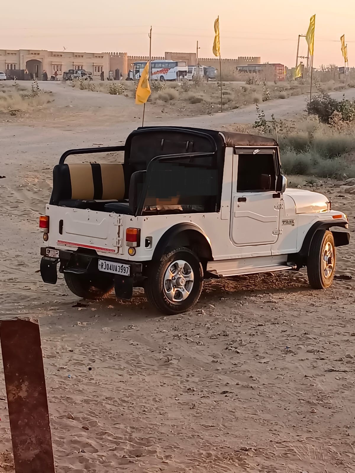 Jeep driving through desert dunes